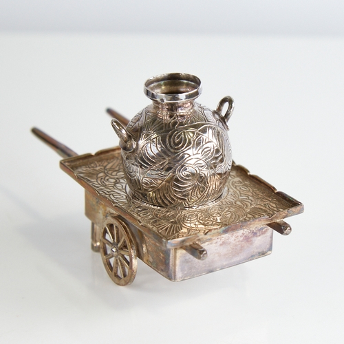 1117 - A 20th century Egyptian miniature silver cart and amphora, engraved foliate decoration, cart length ... 