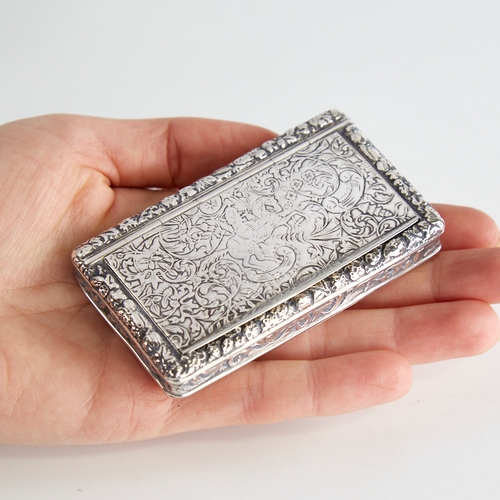 1118 - A 19th century French silver snuffbox, allover engraved floral decoration with hinged lid and rose-g... 