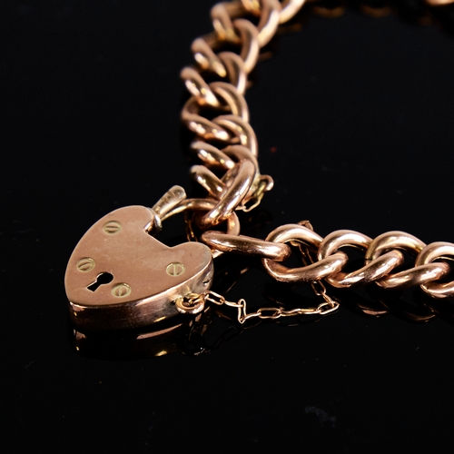 1119 - An early 20th century 9ct rose gold hollow curb link heart padlock charm bracelet, hallmarks Chester... 