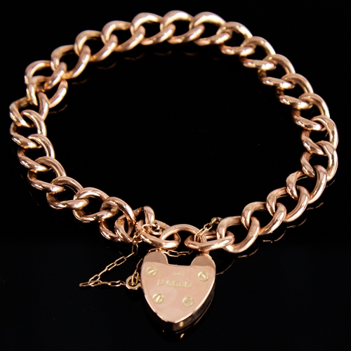 1119 - An early 20th century 9ct rose gold hollow curb link heart padlock charm bracelet, hallmarks Chester... 