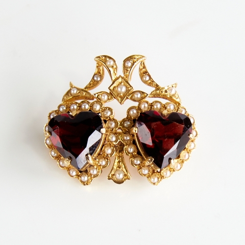 1120 - A late 20th century 9ct gold garnet and split pearl double-heart brooch, with ribbon surround, maker... 