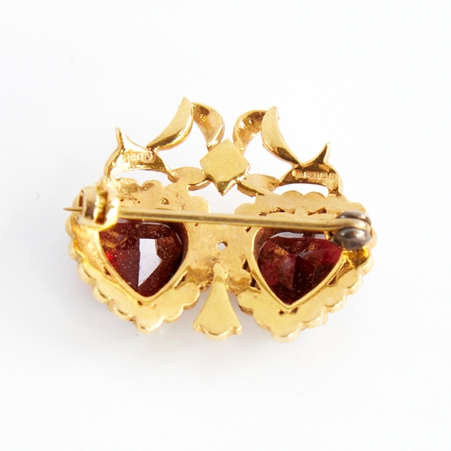 1120 - A late 20th century 9ct gold garnet and split pearl double-heart brooch, with ribbon surround, maker... 