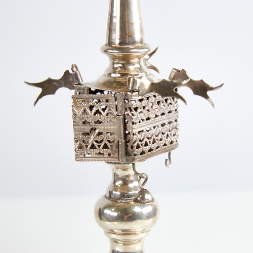 1121 - An unmarked silver Judaica besamim spice tower, with pierced openwork body rotating flags and suspen... 