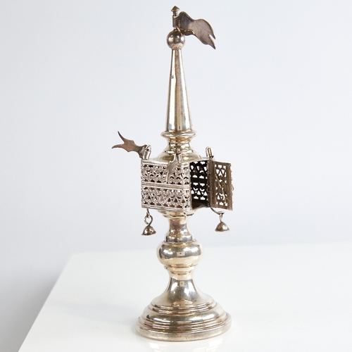 1121 - An unmarked silver Judaica besamim spice tower, with pierced openwork body rotating flags and suspen... 