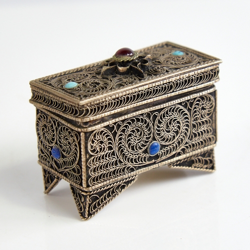 1124 - An unmarked silver Judaica miniature casket, floral wirework decoration set with cabochon garnet tur... 