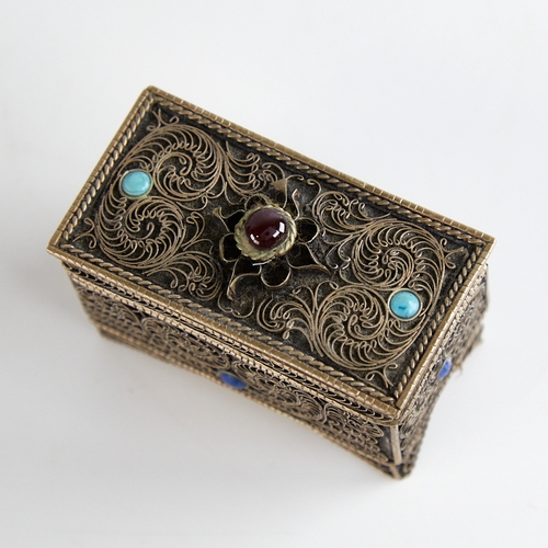 1124 - An unmarked silver Judaica miniature casket, floral wirework decoration set with cabochon garnet tur... 