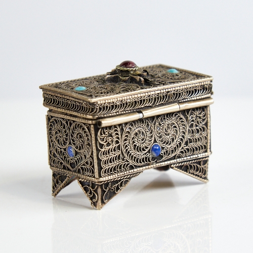 1124 - An unmarked silver Judaica miniature casket, floral wirework decoration set with cabochon garnet tur... 