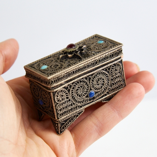 1124 - An unmarked silver Judaica miniature casket, floral wirework decoration set with cabochon garnet tur... 