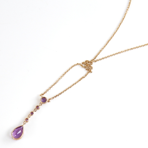 1131 - An Edwardian style 9ct gold amethyst line drop pendant necklace, set with round and pear-cut amethys... 