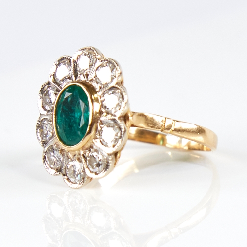 1133 - A Continental unmarked gold emerald and diamond cluster flowerhead ring, total diamond content appro... 