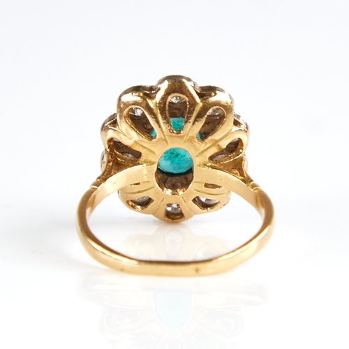 1133 - A Continental unmarked gold emerald and diamond cluster flowerhead ring, total diamond content appro... 