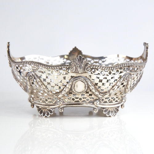 1135 - A Victorian silver sweetmeat basket, bead-edge border with acanthus leaf decoration, pierced noughts... 