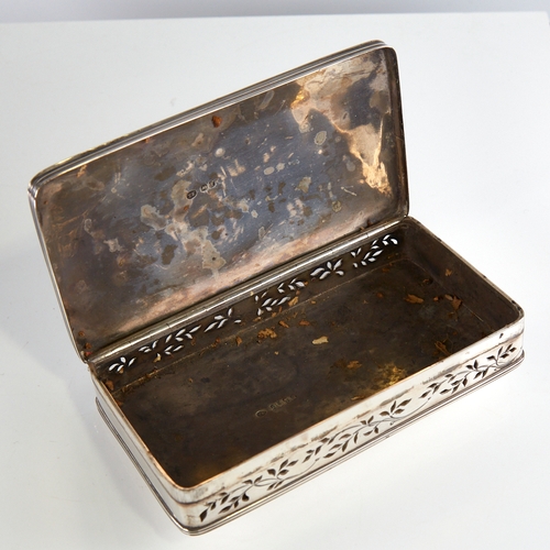 1136 - A George IV rectangular silver pot pourri box, reeded edge of lid with pierced floral long side pane... 