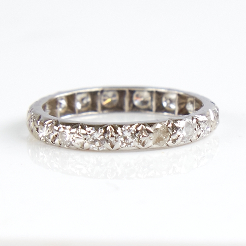 1139 - An unmarked white metal diamond eternity ring, total diamond content approx 0.8ct, band width 2.7mm,... 