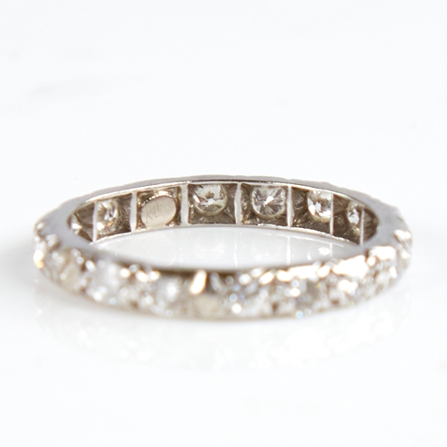 1139 - An unmarked white metal diamond eternity ring, total diamond content approx 0.8ct, band width 2.7mm,... 