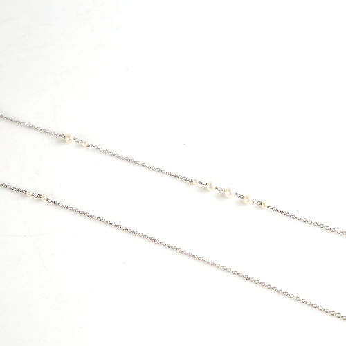 1149 - A long unmarked white gold pearl sautoir necklace, fine cable links with graduated pearl spacers, te... 