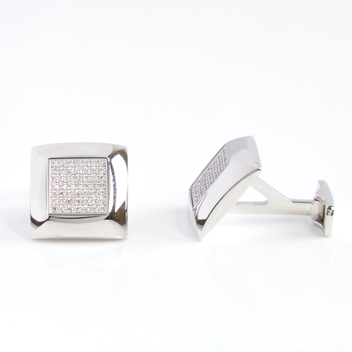 1155 - A modern pair of 18ct white gold diamond cluster cufflinks, square panels set with round brilliant-c... 