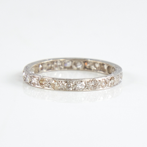 1158 - An early 20th century unmarked white metal diamond eternity ring, set with 26 round eight-cut diamon... 