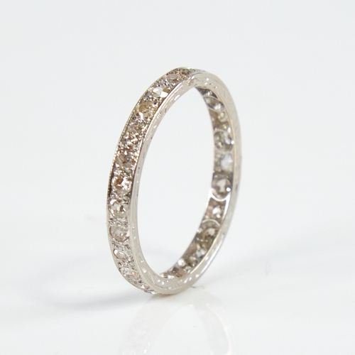 1158 - An early 20th century unmarked white metal diamond eternity ring, set with 26 round eight-cut diamon... 