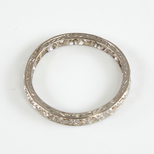 1158 - An early 20th century unmarked white metal diamond eternity ring, set with 26 round eight-cut diamon... 