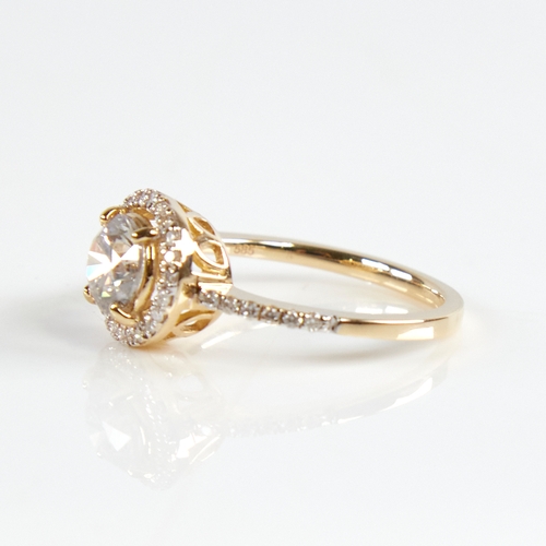 1160 - A modern 14ct gold diamond halo cluster ring, set with round brilliant-cut diamonds and diamond set ... 