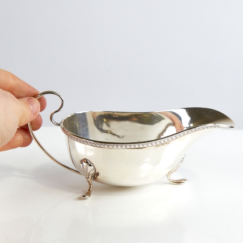 1161 - A George V silver sauce boat, gadrooned rim with scrolled acanthus leaf feet, by William Neale & Son... 