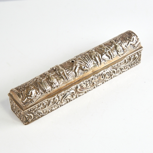 1165 - A George V silver dome-top dressing table box, long rectangular form with relief embossed decoration... 