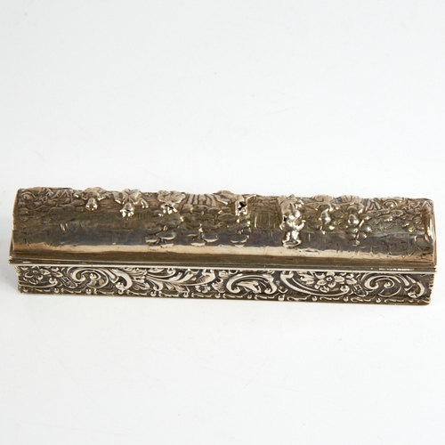 1165 - A George V silver dome-top dressing table box, long rectangular form with relief embossed decoration... 