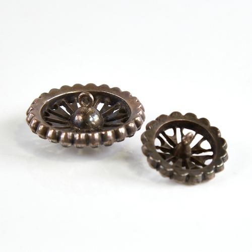 1166 - A set of 12 Georgian unmarked silver and colourless paste dress buttons, pierced sunburst design wit... 