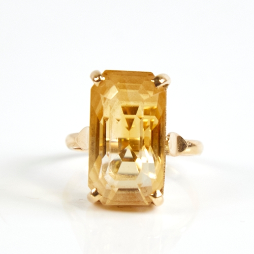 1168 - A late 20th century 14ct gold citrine dress ring, set with large emerald step-cut citrine, citrine l... 