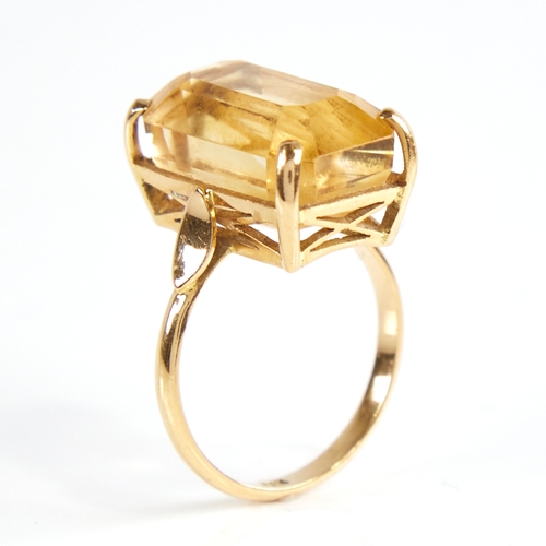 1168 - A late 20th century 14ct gold citrine dress ring, set with large emerald step-cut citrine, citrine l... 