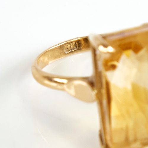 1168 - A late 20th century 14ct gold citrine dress ring, set with large emerald step-cut citrine, citrine l... 