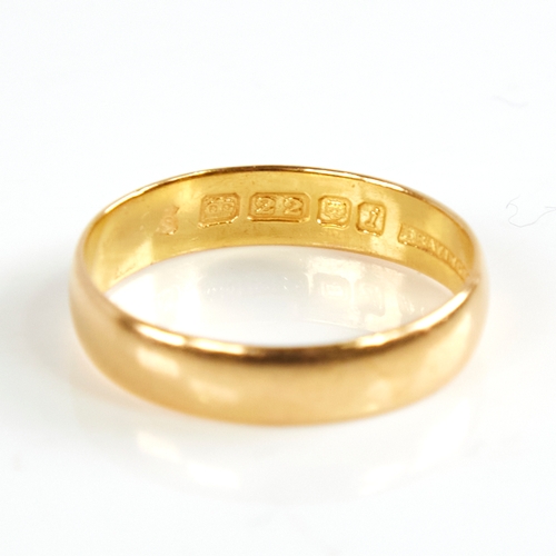 1169 - A mid-20th century 22ct gold wedding band ring, retailed by Bravingtons, hallmarks London 1964, band... 