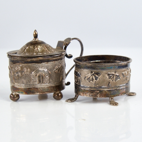 1177 - An early 20th century Indian unmarked silver 2-piece cruet set, comprising mustard pot and salt cell... 