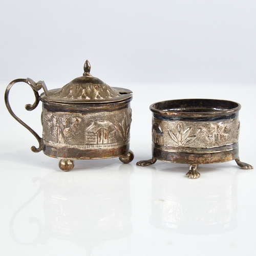 1177 - An early 20th century Indian unmarked silver 2-piece cruet set, comprising mustard pot and salt cell... 