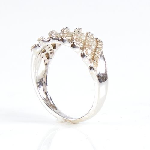 1181 - A modern 9ct white gold diamond cluster half hoop ring, set with round and tapered baguette-cut diam... 