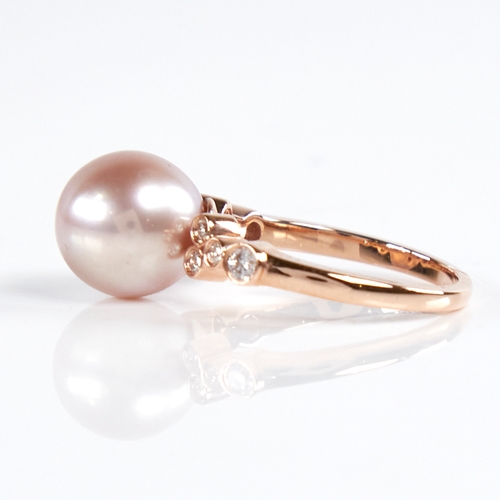 1187 - A modern 14ct rose gold pearl and diamond dress ring, set with whole pink South Sea pearl and round ... 