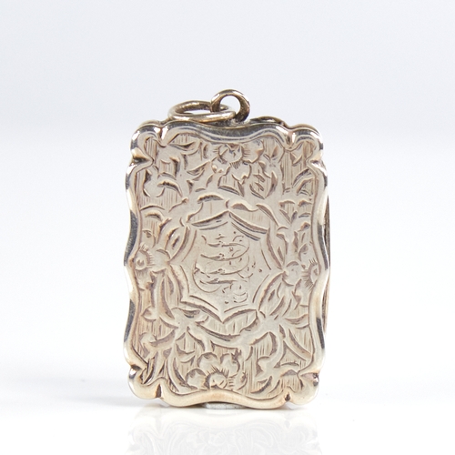 1190 - A Victorian silver vinaigrette, scalloped rectangular form with allover engraved floral decoration, ... 