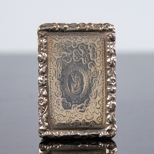 1191 - A George III silver vinaigrette, rectangular form with relief floral border and bright-cut engraved ... 