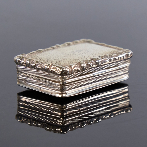 1191 - A George III silver vinaigrette, rectangular form with relief floral border and bright-cut engraved ... 