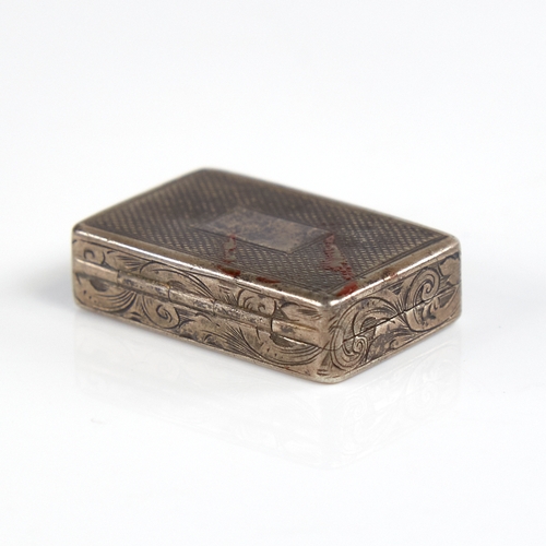 1195 - A Victorian silver vinaigrette, plain rectangular form with engine turned decoration and foliate eng... 