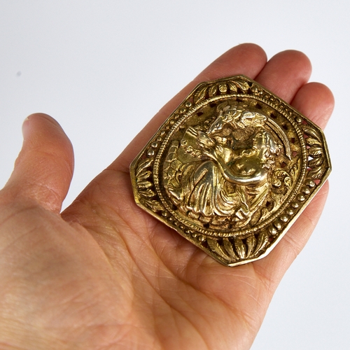 1203 - A large 19th century unmarked silver-gilt brooch, depicting Hebe the Greek Goddess of Youth feeding ... 