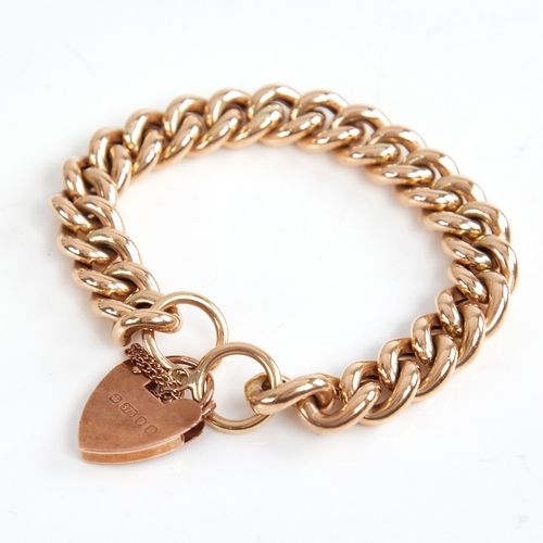 1205 - An unmarked gold hollow curb link bracelet, with 9ct heart padlock clasp, hallmarks London 1995, bra... 