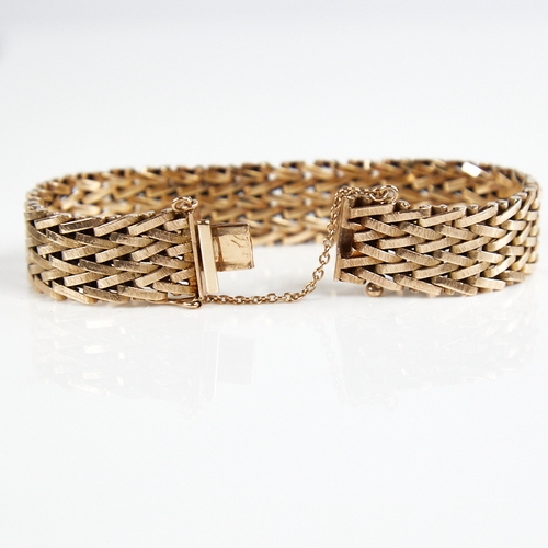 1208 - A Vintage 9ct gold bracelet, textured articulated form, band width 14.9mm, bracelet length 18cm, 39.... 