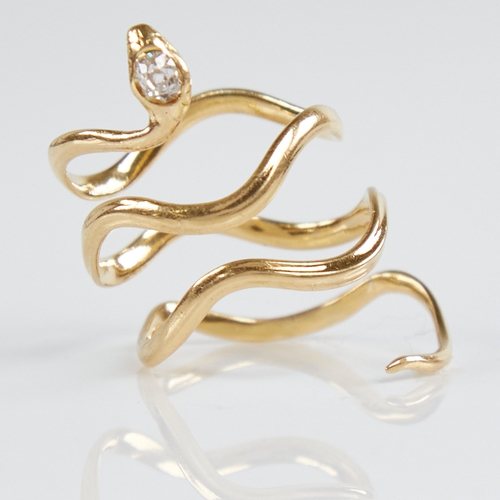 1211 - An unmarked gold diamond figural snake/serpent ring, the head set with an oval old-cut diamond, diam... 