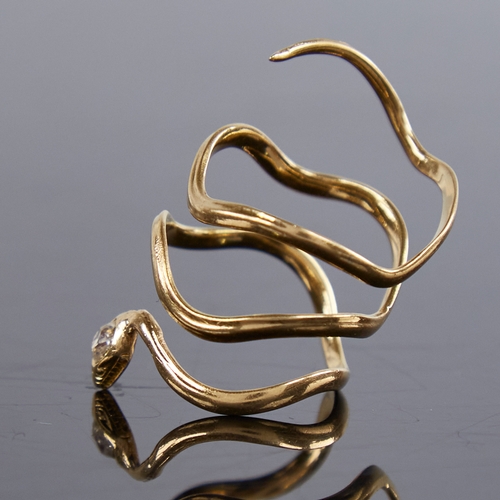 1211 - An unmarked gold diamond figural snake/serpent ring, the head set with an oval old-cut diamond, diam... 