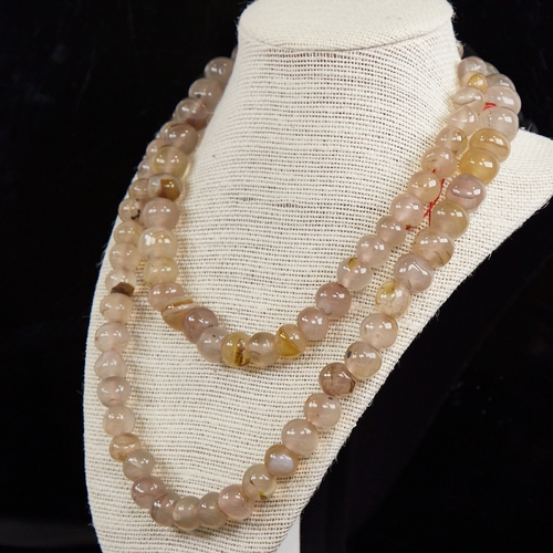 1213 - A long graduated polished chalcedony agate bead necklace, largest bead diameter 14.8mm, necklace len... 