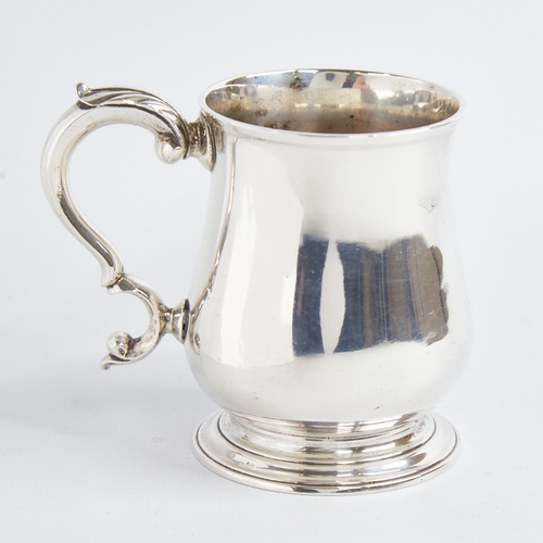 1215 - A George III silver christening tankard mug, baluster form with scrolled acanthus leaf handle, indis... 