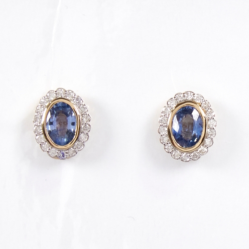 1223 - A modern pair of 14ct gold sapphire and diamond cluster stud earrings, set with oval-cut sapphires s... 