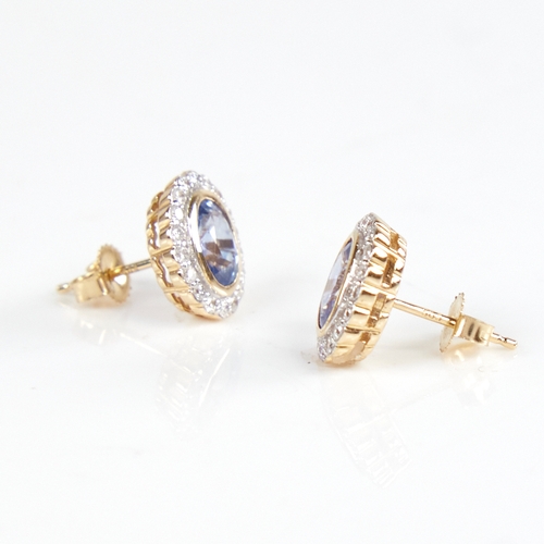 1223 - A modern pair of 14ct gold sapphire and diamond cluster stud earrings, set with oval-cut sapphires s... 